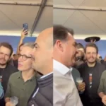 Flávio Bolsonaro e Romeu Zema durante brinde com leite na Megaleite em Belo Horizonte