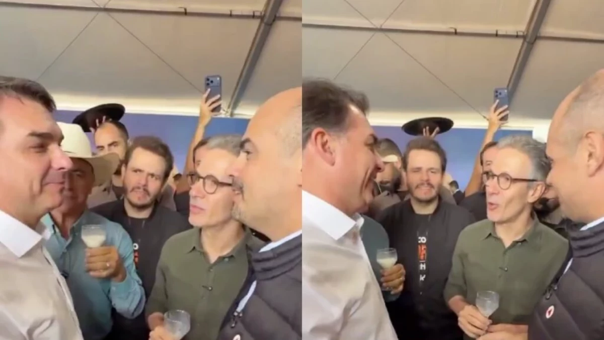 Flávio Bolsonaro e Romeu Zema durante brinde com leite na Megaleite em Belo Horizonte